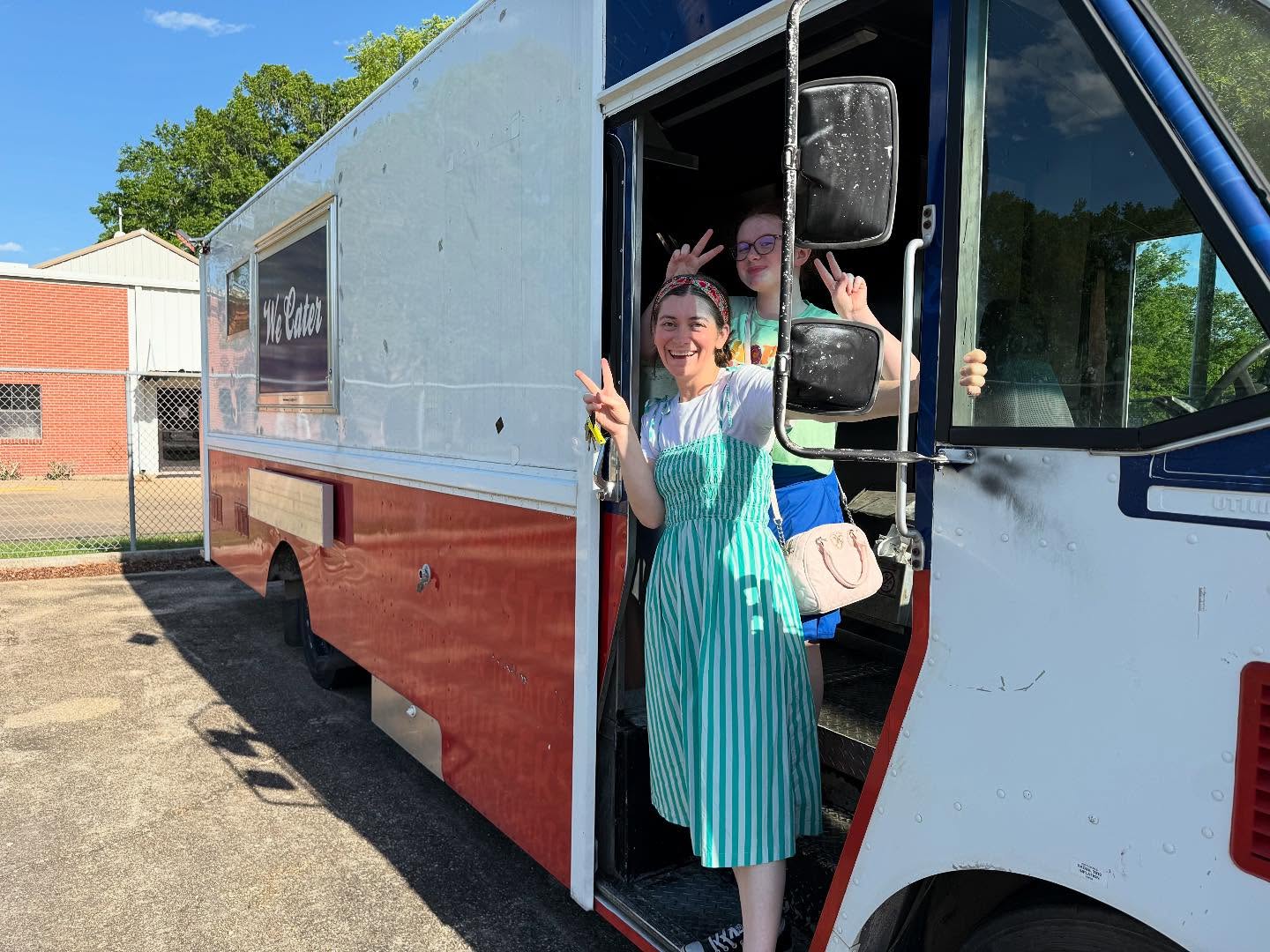 Maggie and Krislyn Grace the day they signed the papers on the food truck